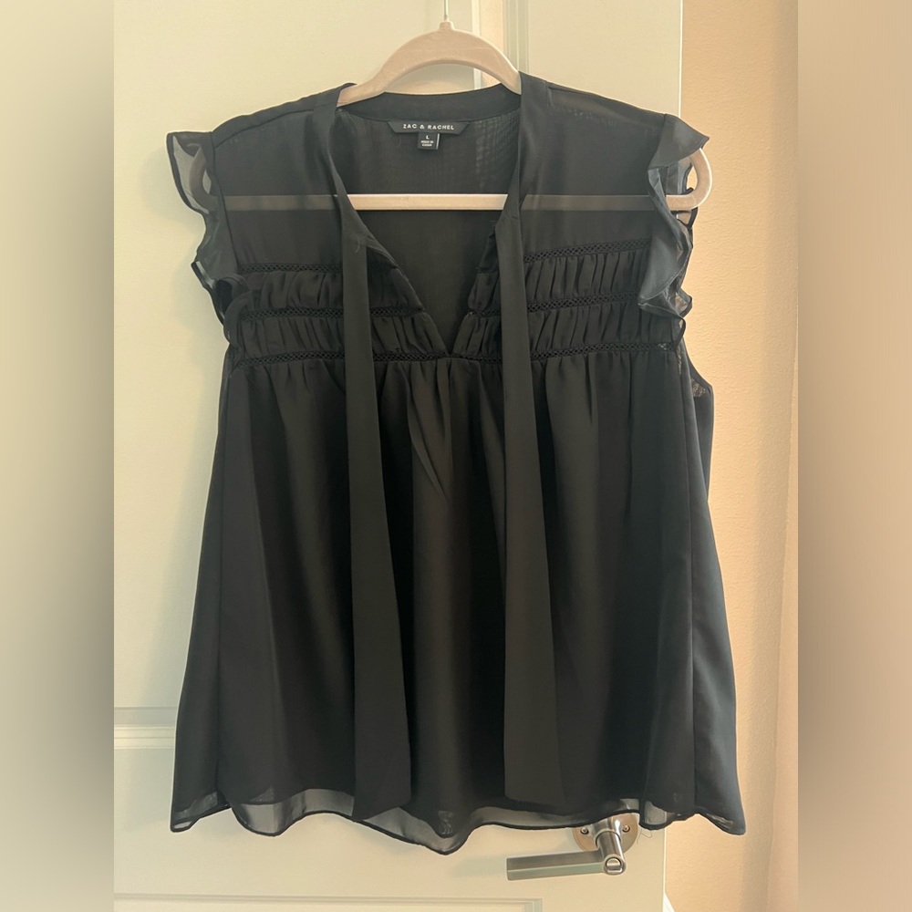 Black sleeveless blouse